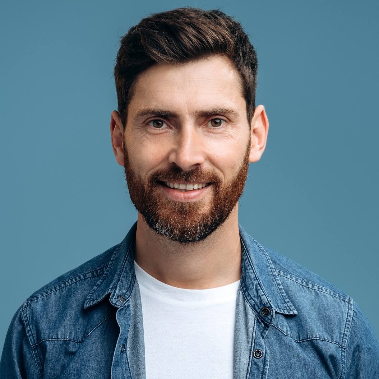 portrait of cheerful handsome man in denim shirt s ZXG9M4P.jpg