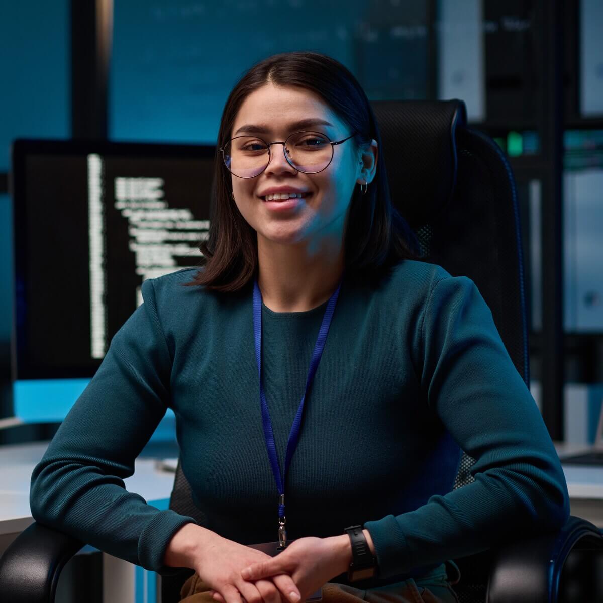 smiling girl as female computer programmer at work JD53B77.jpg